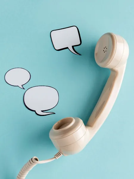Telephone handset with speech bubbles